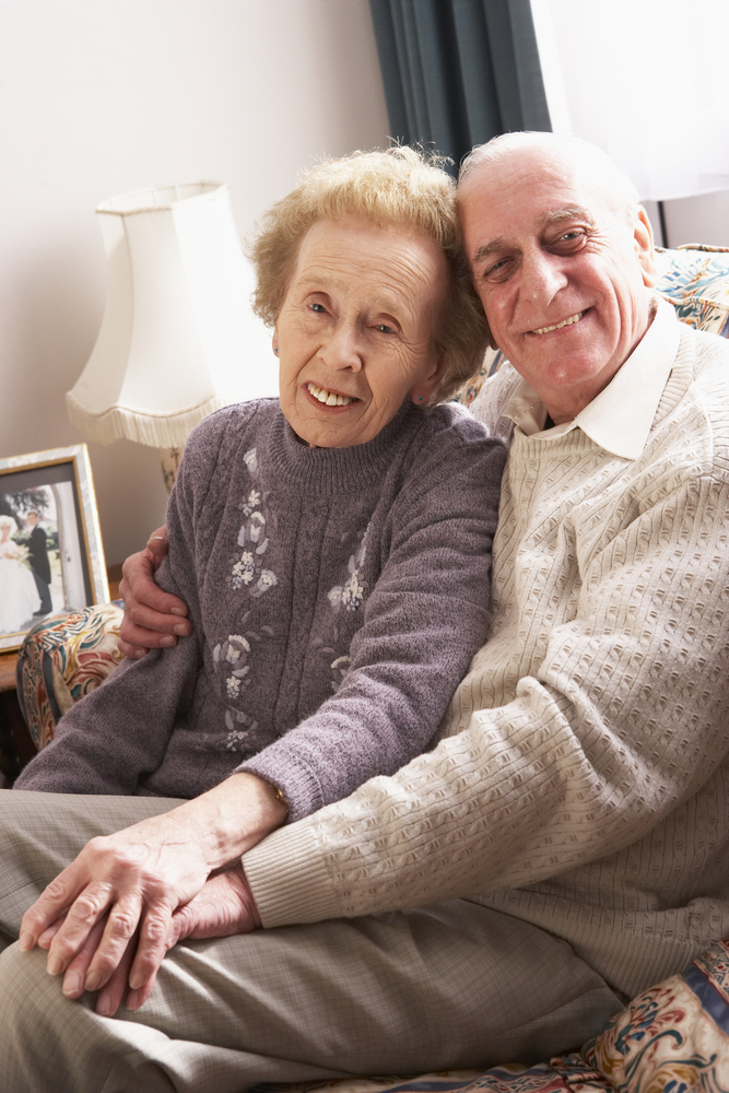 Loving Senior Couple Relaxing At Home