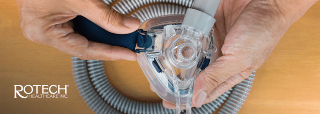 Person's hands assembling a CPAP mask