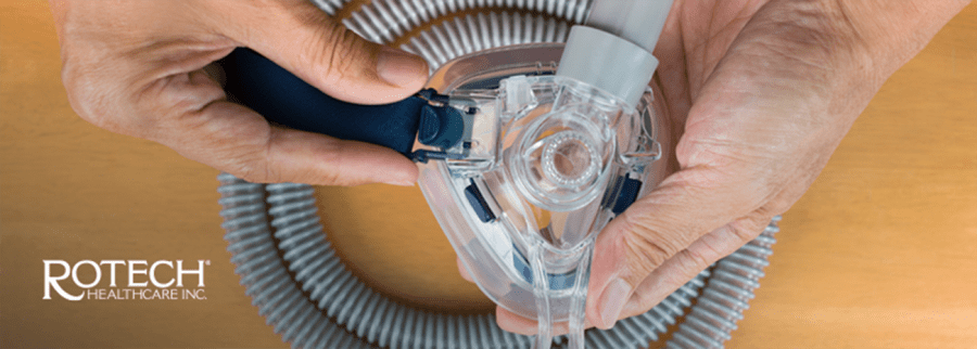 Person's hands assembling a CPAP mask