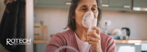 Woman using an oxygen mask in her home