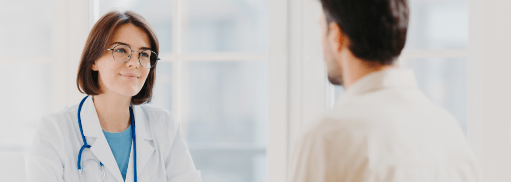 Healthcare professional smiling at patient