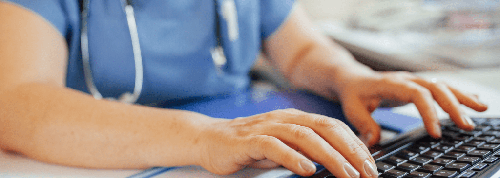 Healthcare professional typing at keyword
