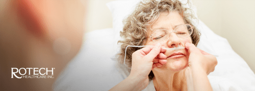 Woman having nasal cannula inserted into nose
