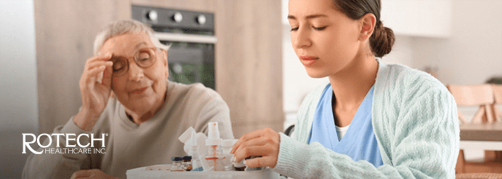 Caregiver helping elderly woman with wound care at home