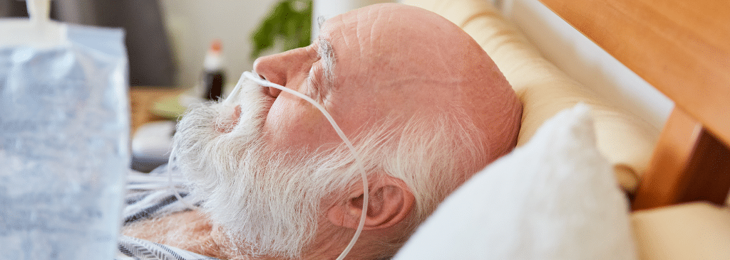 Man sleeping with oxygen cannula in his nose